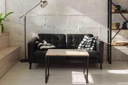 Elegant black sofa in modern living room interiorの写真素材