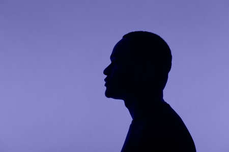 Man silhouette pose on very peri colour of 2022 backgroundの写真素材