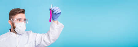 Covid-19 coronavirus, Vaccine development, pandemic, outbreak and medicine concept - Man scientist...