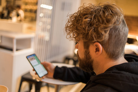Social media and digital online concept - young man using smart phone with Social media. Living on vacation and playing social media conceptの写真素材