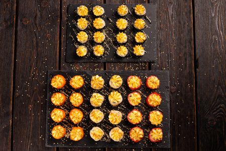 Japanese salmon sushi with spicy mayonnaise and tobiko caviar - Sushi menu norimaki and uramaki....