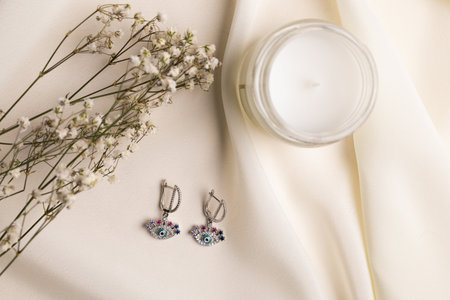 Handmade jewelry on a textile background. Gift for women. Bijouterie and jewellery for women
