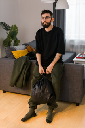 Sad man pondering about his life after a relationship breakup or bipolar disorder - depression asthenia , mental problem and anxiety disorder conceptの写真素材