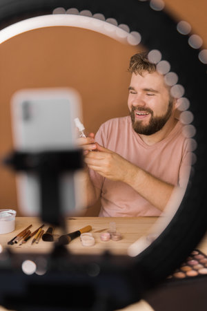 Man make up vlogger recording broadcast about cosmetics and tutorials for make-up artistの写真素材