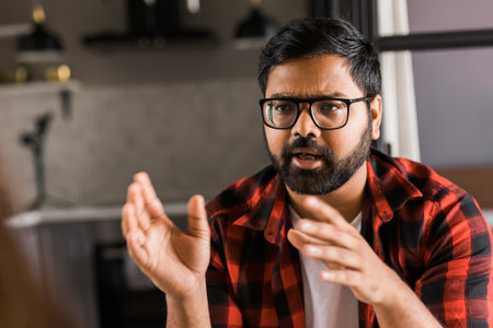 Head shot portrait smart confident smiling millennial indian man. Handsome hindu student guy freelancer at homeの写真素材