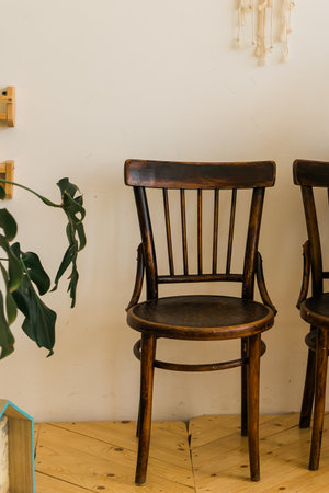 Old fashioned chair on wooden floor in roomの写真素材