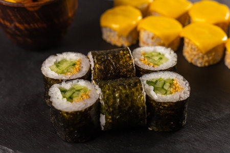 Sushi rolls set on dark background close-up. Japanese and asian food conceptの写真素材