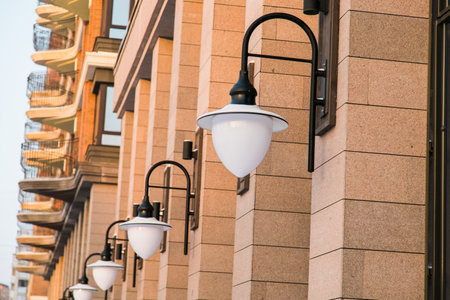 Low angle view of an apartment building with balconies and street lamp light