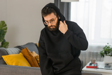 Sad man pondering about his life after a relationship breakup or bipolar disorder - depression asthenia , mental problem and anxiety disorder conceptの写真素材