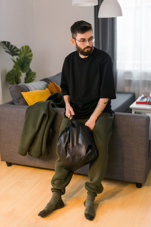Sad man pondering about his life after a relationship breakup or bipolar disorder - depression asthenia , mental problem and anxiety disorder conceptの写真素材
