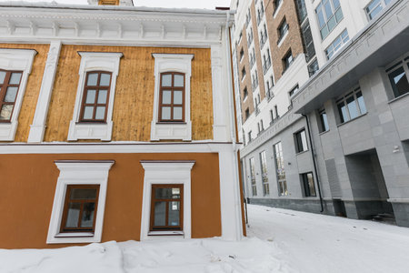 Building and houses in winter season. Snow in city and town architectureの写真素材