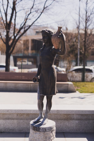 YEREVAN. ARMENIA. 29 MARCH 2022 : A sculpture of a girl with a jug in the park dedicated to the 2800th anniversary of Yerevan.のeditorial素材