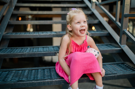 Funny baby with cochlear implant walks outdoor. Hearing aid and medicine innovating technology...