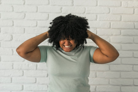 African american woman on brick background.