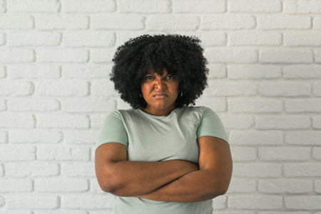 Portrait of young african american woman with frowning expressionの写真素材