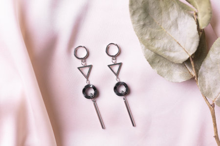 Female Jewelry. Vintage bijouterie jewelry. Beautiful handmade silver earrings on pink silk...