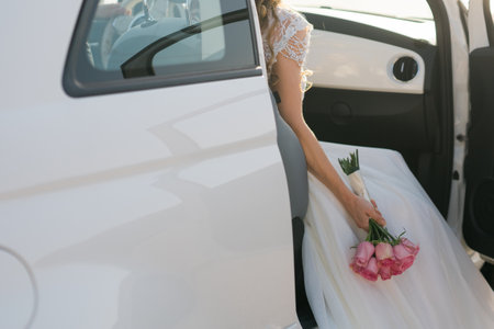 Bride holds a wedding bouquet, wedding dress, wedding details.の写真素材