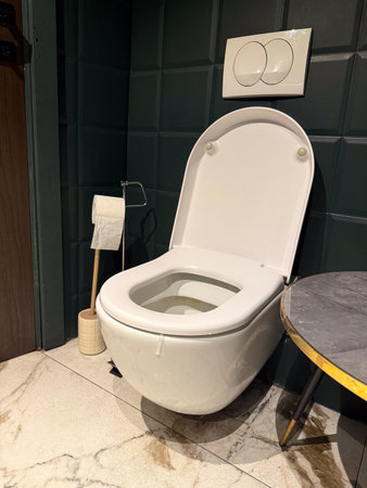 Modern bathroom with toilet and marble floor interior design. Sanitary facility symbolizing hygiene, household lifestyle and modern convenience.の写真素材