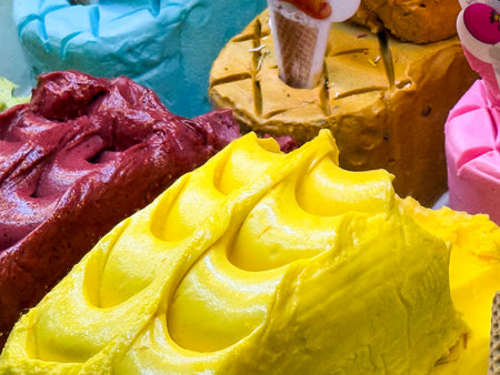 Bright gelato flavors on display. Dessert, color, and culinary art in frozen sweets.の写真素材
