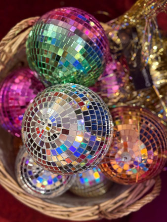 Christmas Colorful disco ornaments stacked in festive basket. Holiday variety, Christmas decor,...