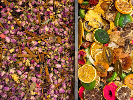 Dried rosebuds mixed with cinnamon sticks forming a dense herbal tea surface in Istanbul bazaar. Floral infusions, aromatic rituals, and botanical wellness traditions expressed through color, texture, and natural composition.の写真素材