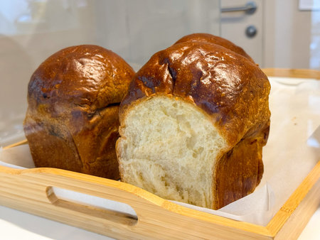Multigrain Sourdough Bread, Artisan Loaf on Linen Fabric, Fresh Crusty Bread with Seeds. The crispy...
