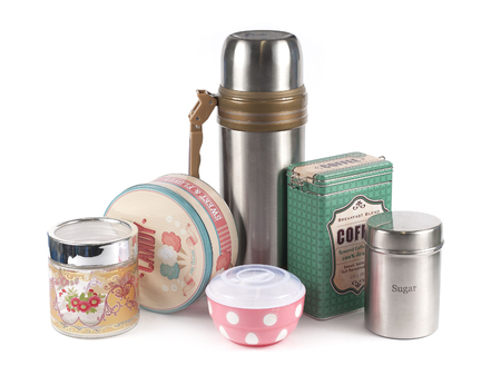 Empty glass jars and other kitchen utensils on a wiht backgroundの写真素材