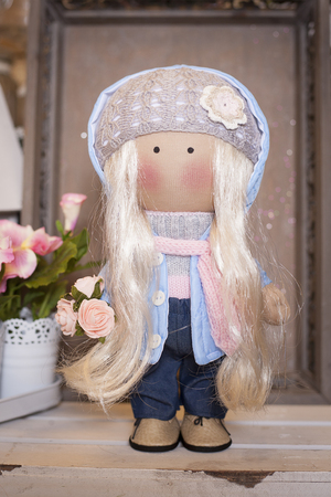 Handmade doll in the interior.の写真素材