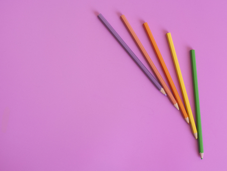 Color pencils on pink background copy spaceの写真素材
