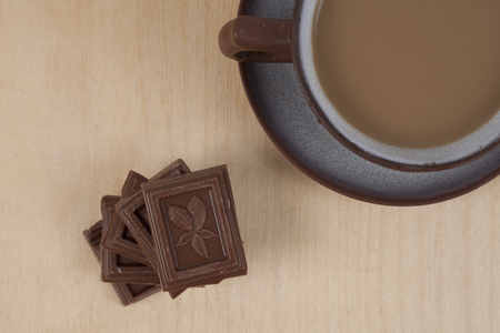 Chocolate and cup of coffee espresso on wood background with marmalade bearsの写真素材