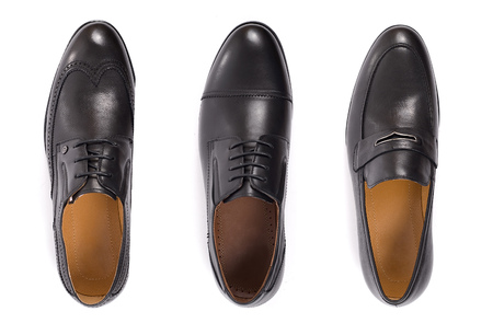 Classic male black leather shoes isolated on a white, top viewの写真素材