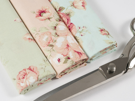 Colorful cotton fabric, meter and scissor