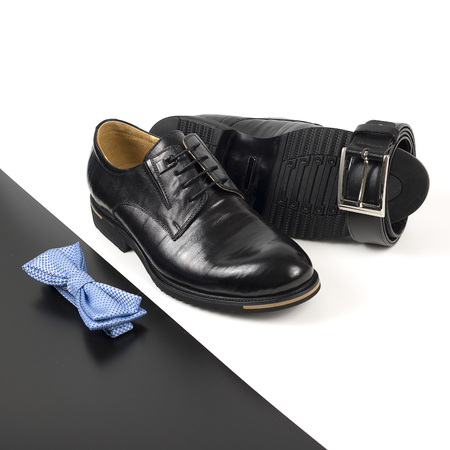 The black man's shoes and accessories isolated on white and black background.の写真素材
