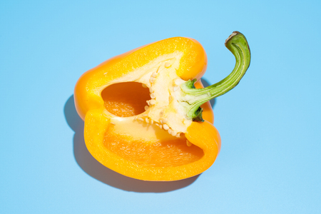 Ripe yellow pepper on blue background. Healthy eating and dieting conceptの写真素材