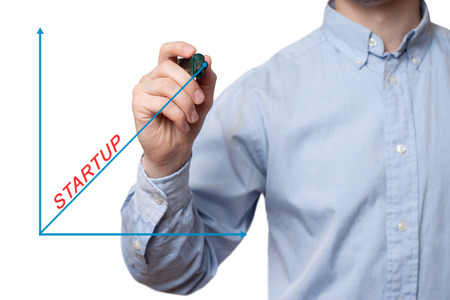 Young businessman prepare to start drawing concept. Businessman drawing a Startup growth graph. Isolated on white.の写真素材