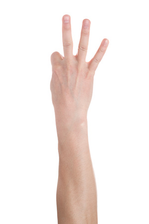 Man showing number three on white background, closeup.の写真素材