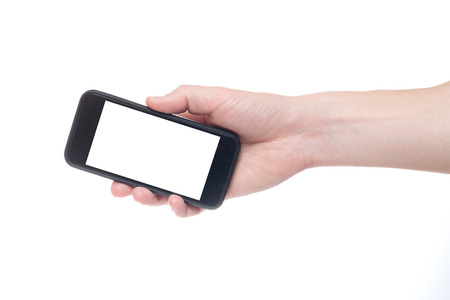 Hand holding black Smartphone with blank screen on white backgroun.の写真素材