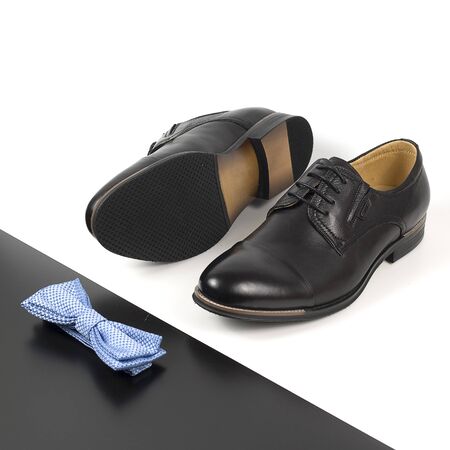The black man's shoes and accessories isolated on white and black background.の写真素材