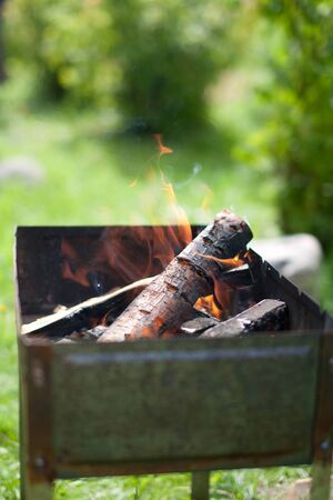 Brazier with fire and coal for cooking. Close-up. Horizontal.の写真素材