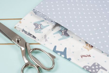 Dressmaking or tailoring scissors on cotton fabricの写真素材