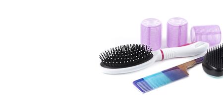 Hairdressing tools and various hairbrushes on white backgroundの写真素材