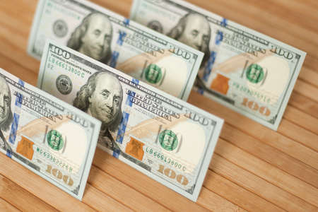 100 Dollars bill and portrait Benjamin Franklin on USA money banknote. Hundred dollar bills on...