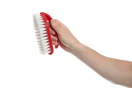 Hand holding cleaning brush on white background. Cleaning house, cleaning concept. Cleaning service...