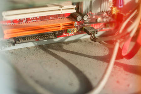 Old computer system unit with dust and spiderweb inside.の写真素材