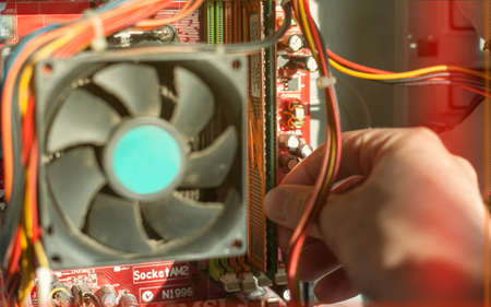 Old computer system unit cooler with dust inside. Dust on the computer pc processor cooler with computer case fragment.の写真素材