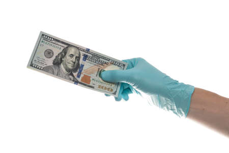 Hand with dollar banknote on white background, closeup. Money, earnings, crediting and finance. 100 Dollars bill in handの写真素材