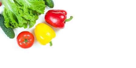 Fresh colorful organic vegetables captured from above (top view, flat lay) isolated on a white...