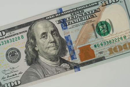 100 Dollars bill and portrait Benjamin Franklin on USA money banknote. Hundred dollar bills on...