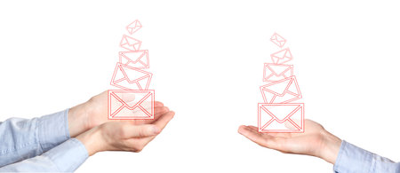 Businessman holding a virtual envelope concept for e-mail, global communications. Mail letter icons on hands, business concept. White backgroundの写真素材