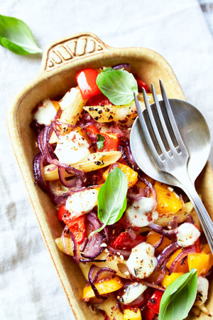 Salad with feta cheese, tomato and red onion, selective focus